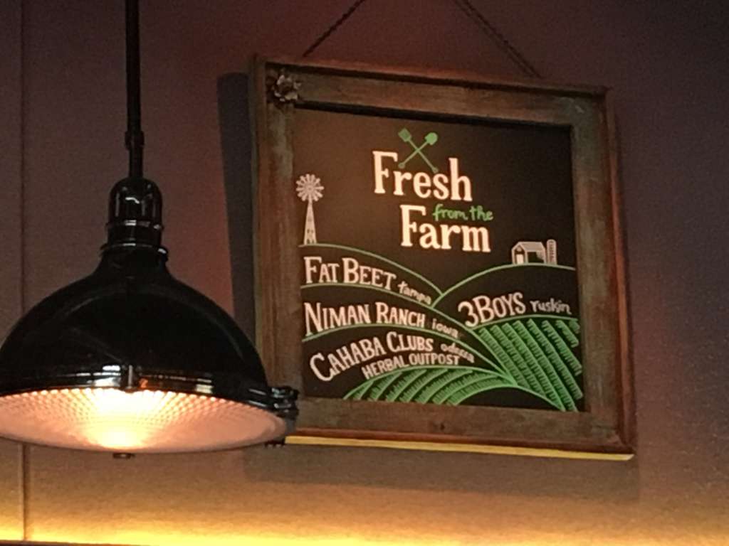 “Fresh from the Farm” sign listing several producers
